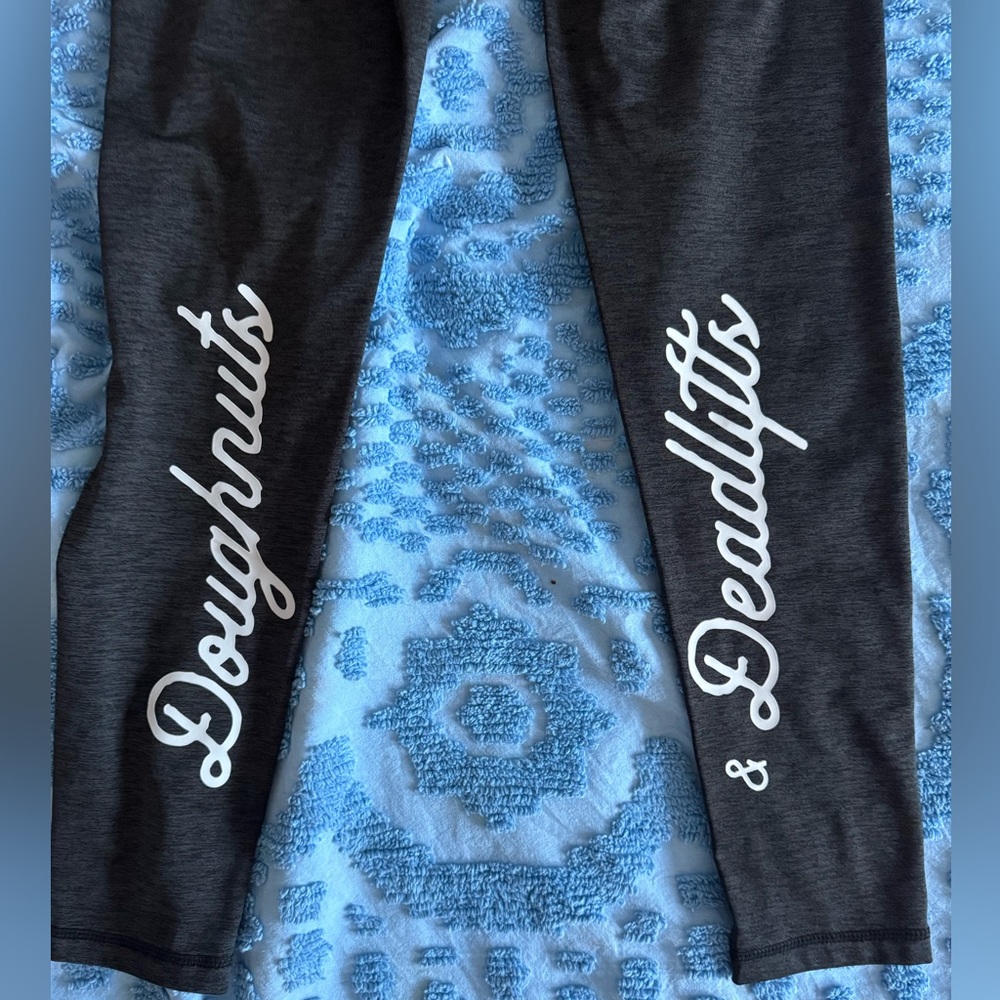 Black Donuts & Deadlifts athletic leggings.
